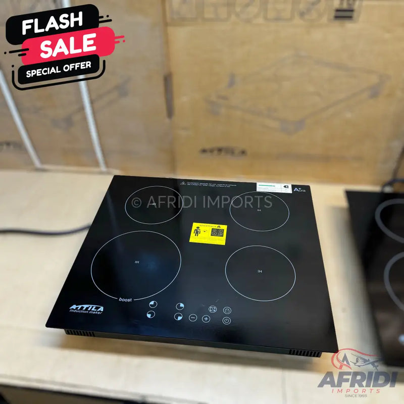 Black four-burner induction cooktop.