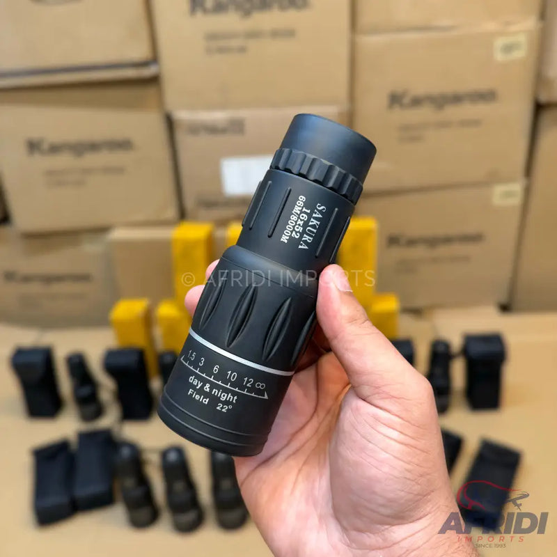 Black monocular with a textured grip, suitable for both day and night use, featuring 16x52 magnification and a 22-degree field of view.