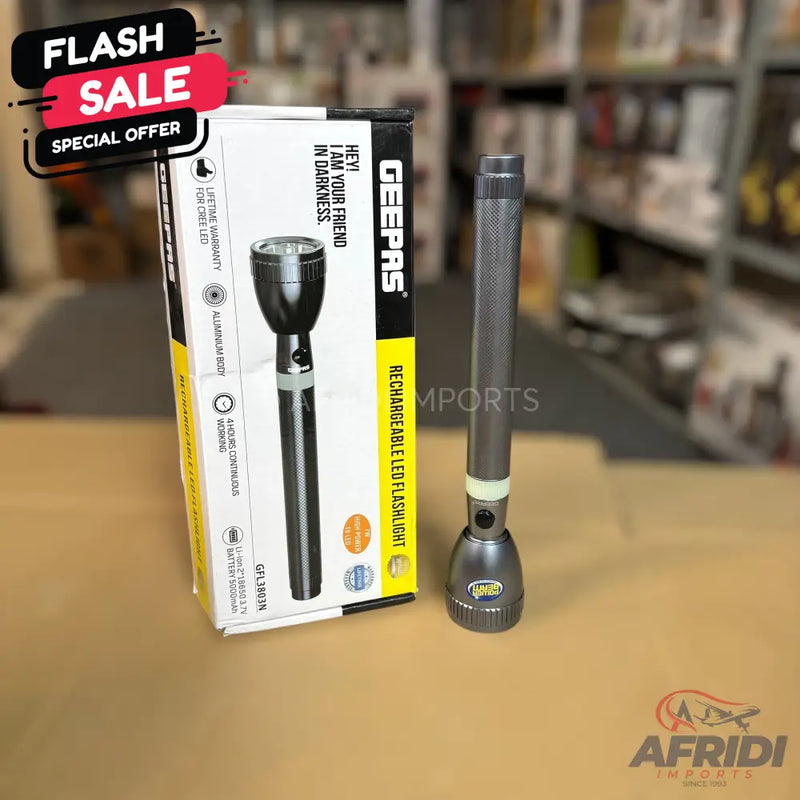 A black and silver rechargeable LED flashlight with its packaging, advertising a ’Flash Sale’ and ’Special Offer.’