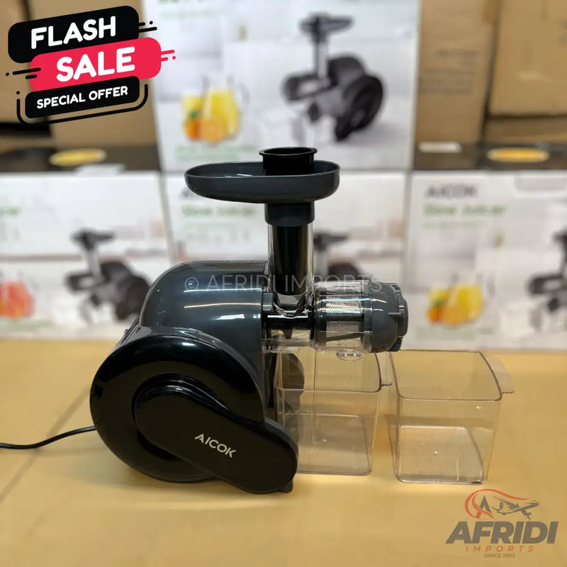 A dark grey and black slow masticating juicer with two clear collection containers.