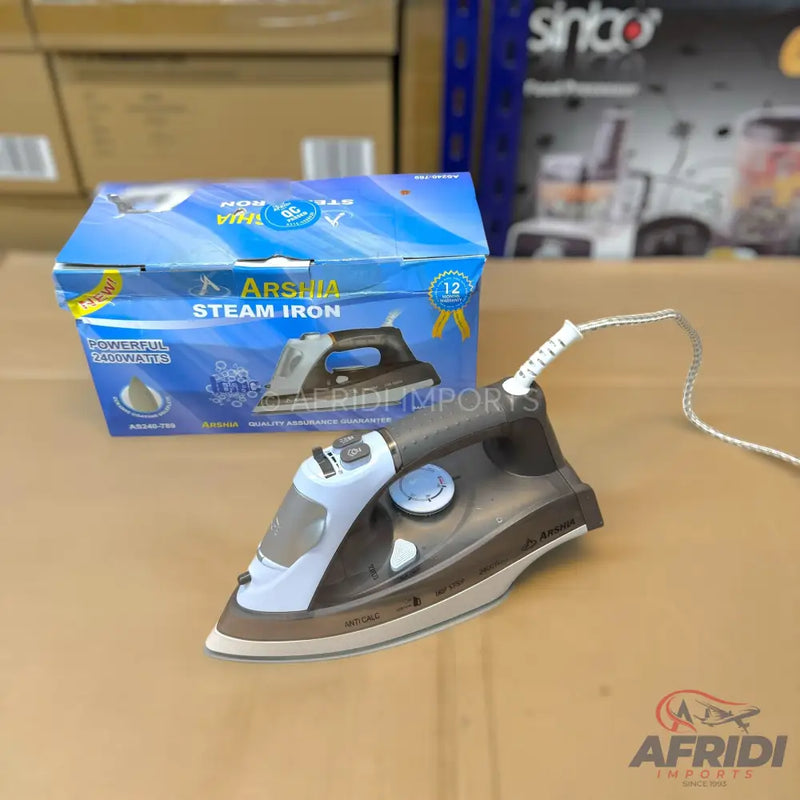 A steam iron with a black and light blue body, white power cord, and a blue box.