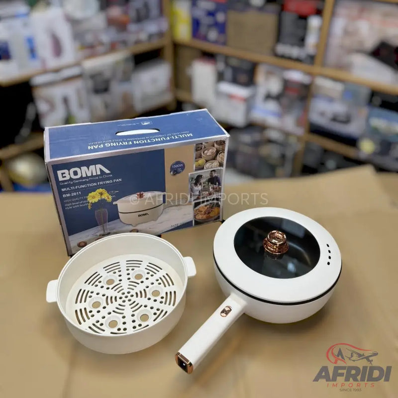 A white multi-function electric frying pan with a steamer insert and a transparent lid.