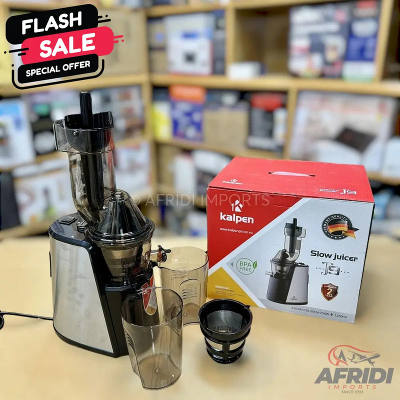 A silver and black slow juicer with an accompanying box and accessories.