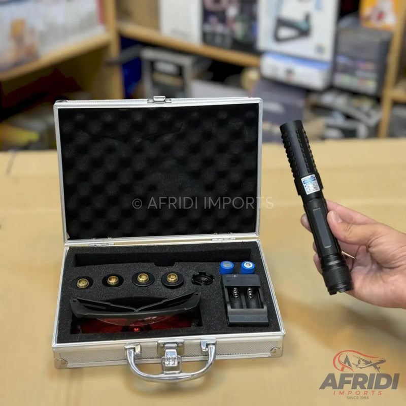A laser pointer kit in a metal carrying case.