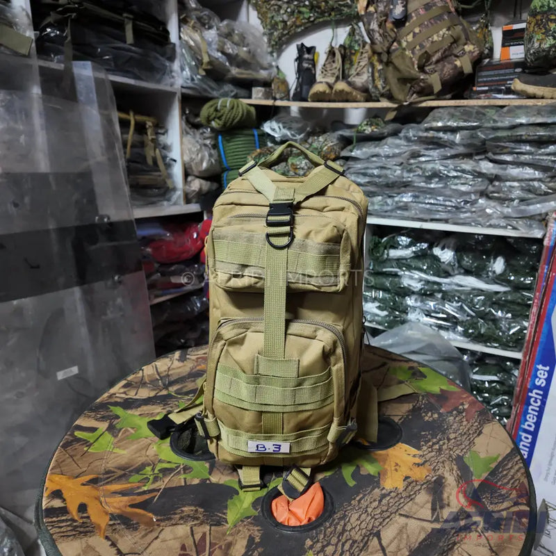 A tan tactical backpack with multiple compartments and MOLLE webbing.