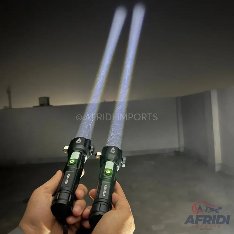 Two black flashlights emitting strong, focused beams of light.
