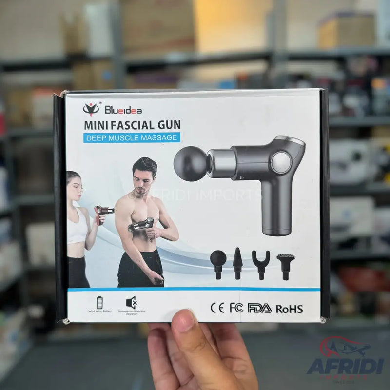 A mini fascia gun for deep muscle massage, with multiple interchangeable head attachments and a rechargeable battery.