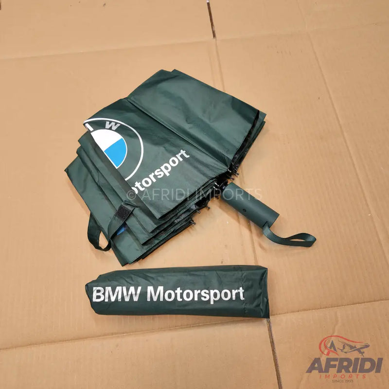 Dark green BMW Motorsport umbrella and carrying sleeve.