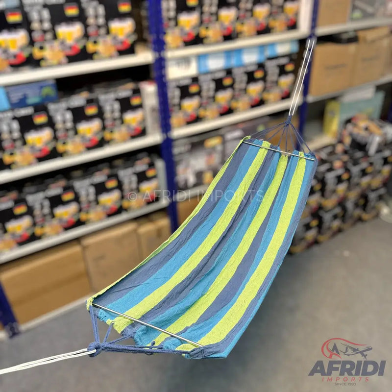 A striped fabric hammock in shades of blue and lime green.