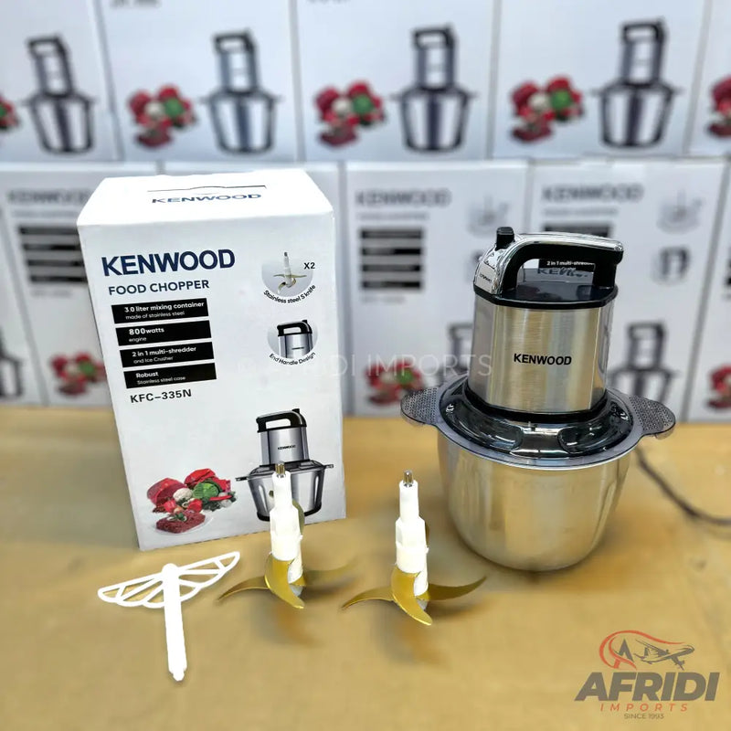 A Kenwood food chopper with a stainless steel bowl and two sets of blades.