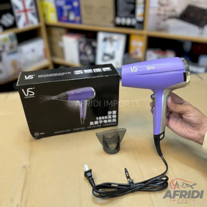 A purple and silver hair dryer with a concentrator nozzle and power cord.