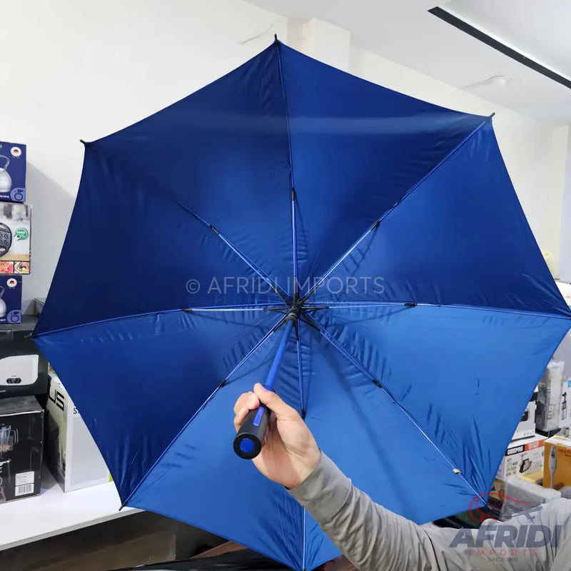 Open blue umbrella with a black handle.