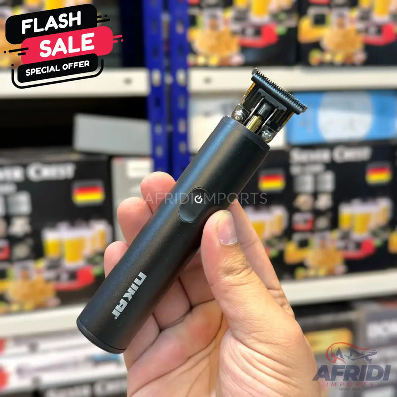Black, cordless hair trimmer with a metallic blade.