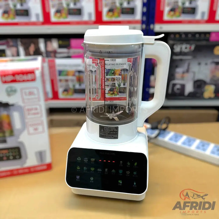 A white electric blender with a transparent pitcher, a handle, and a black digital control panel with various function icons.