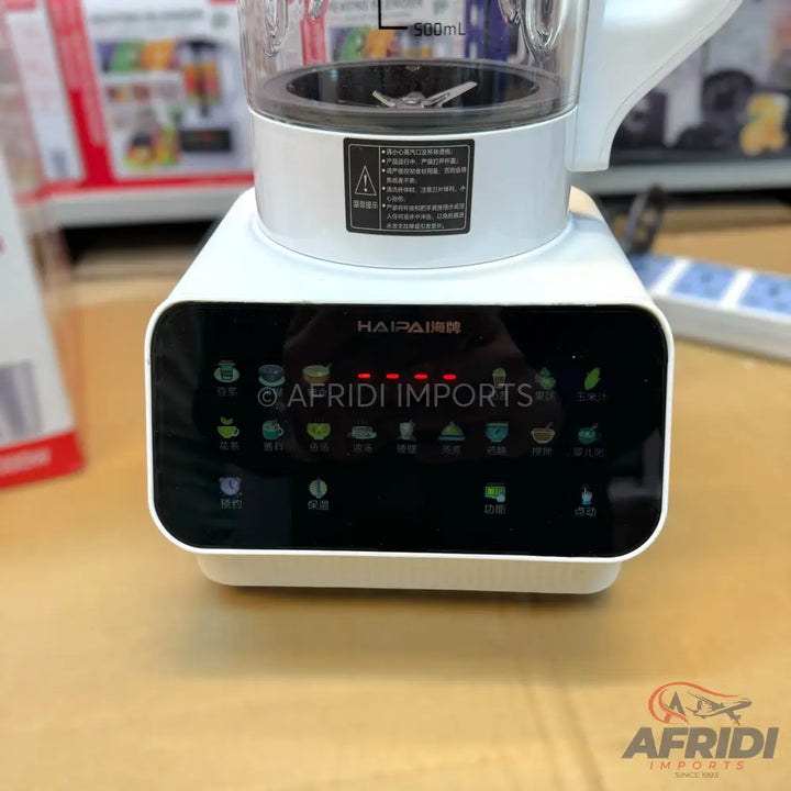 White countertop blender with a digital display and multiple function icons.