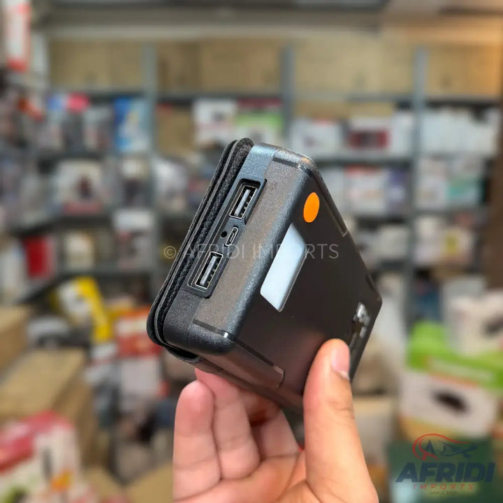 Black portable power bank with multiple USB ports