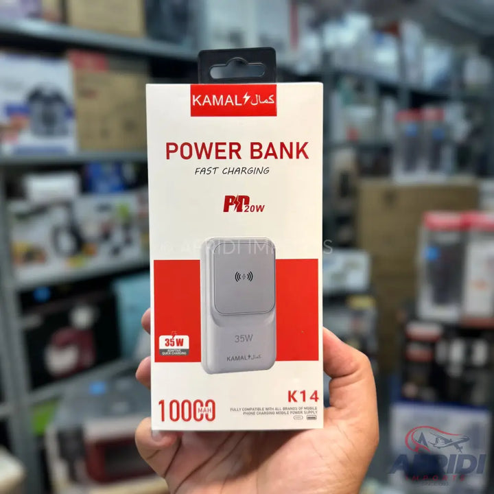 White power bank box with ’KAMAL’ brand and ’FAST CHARGING’ label.