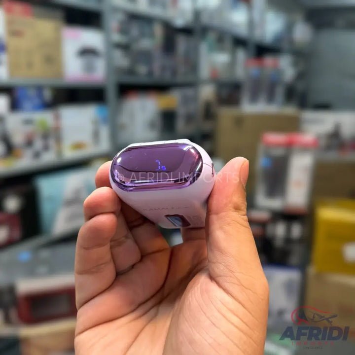 A white and purple handheld device with a transparent, curved top.