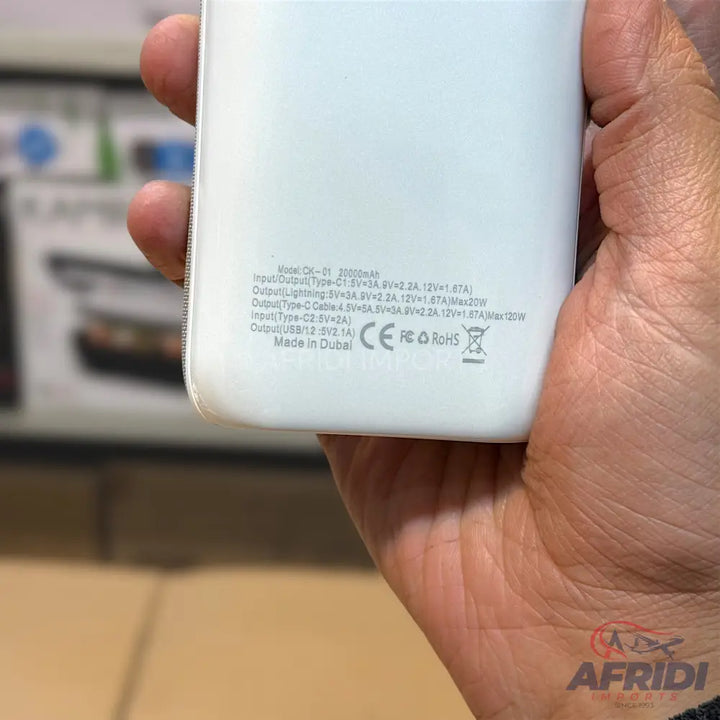 White power bank with detailed electrical specifications.
