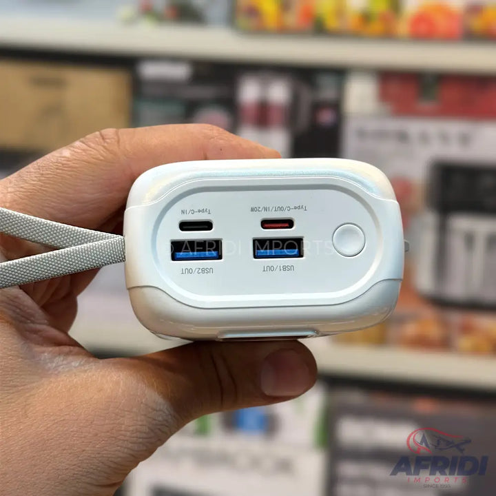 White portable power bank with multiple USB-A and USB-C output ports.