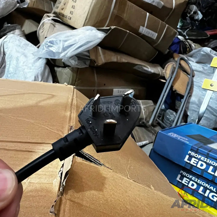 Black three-pin power plug with a cable.