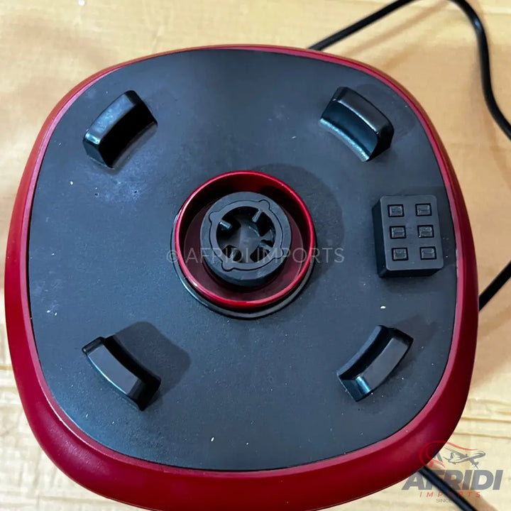 Red and black blender base with detachable blades and control buttons.