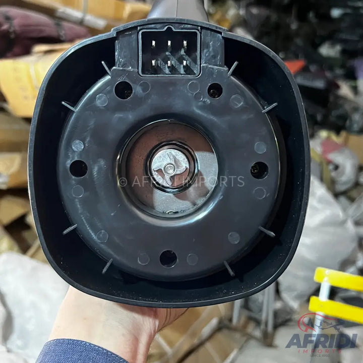 The underside of a blender base with a visible motor coupling and electrical connector.