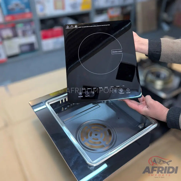 Black induction cooktop with touch controls.