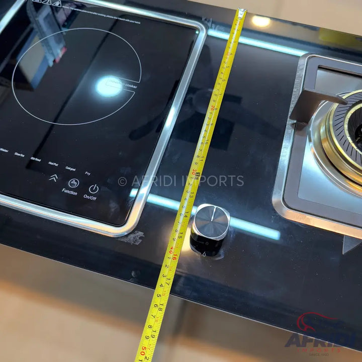 A black glass-top cooking range with an induction burner and a gas burner.