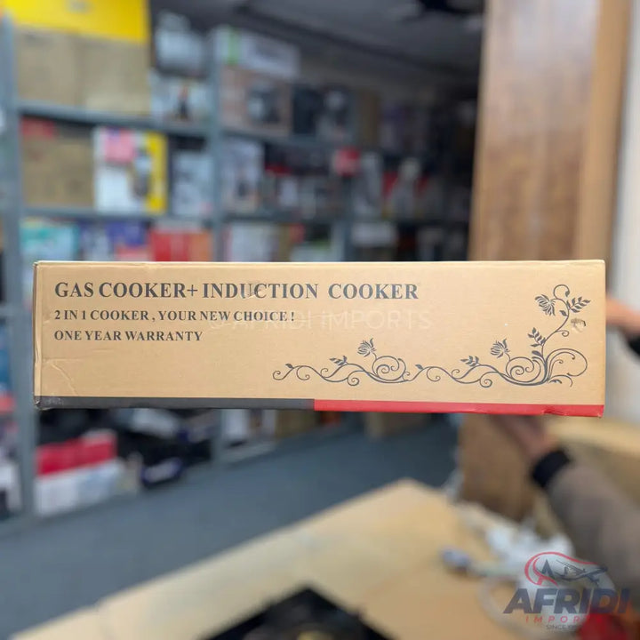 A brown box for a 2-in-1 gas and induction cooker with a one-year warranty.