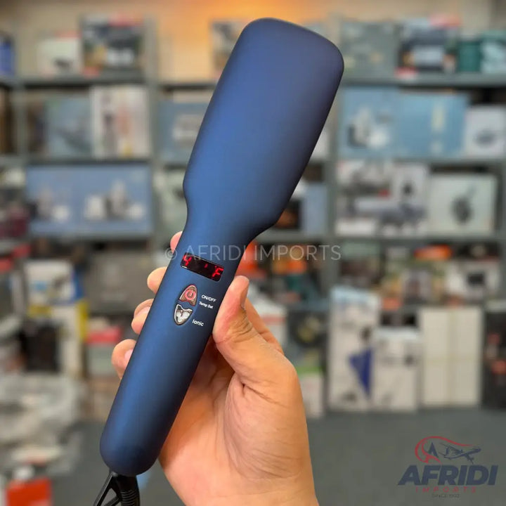 Dark blue electric hair straightening brush with a digital temperature display.