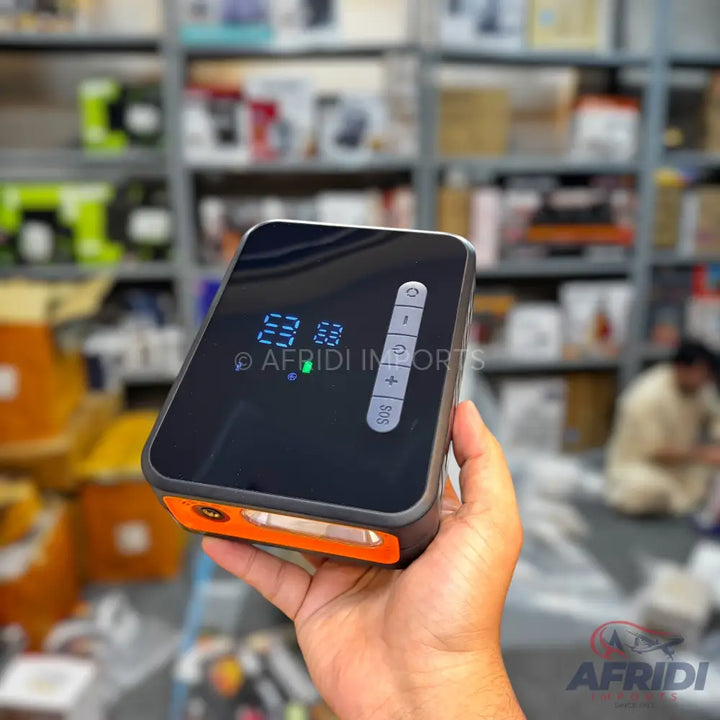 Portable air compressor with a digital display and control buttons.