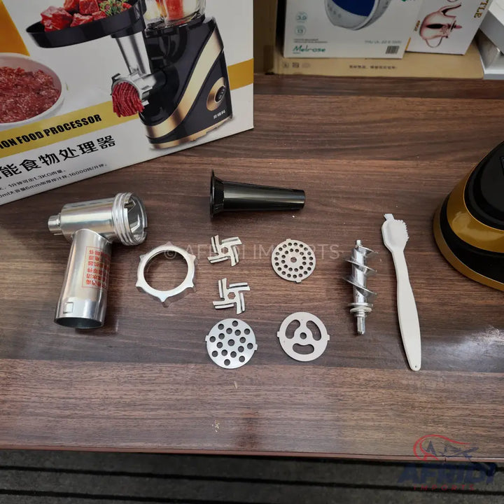 A disassembled electric meat grinder with various attachments.