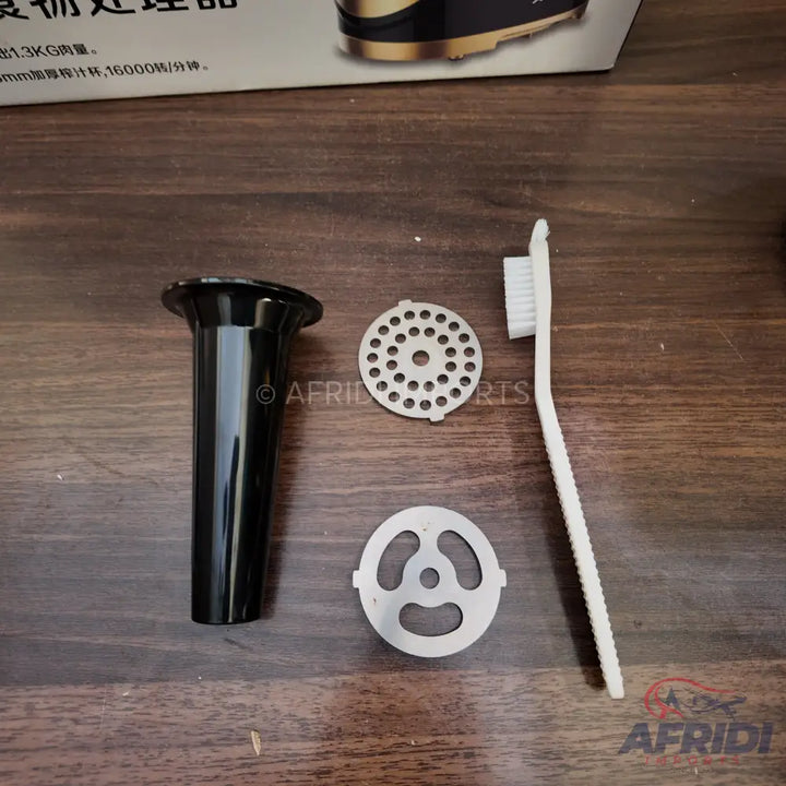 Meat grinder attachments and cleaning brush.