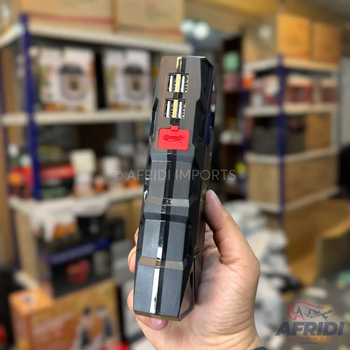 A portable car jump starter with multiple USB ports.