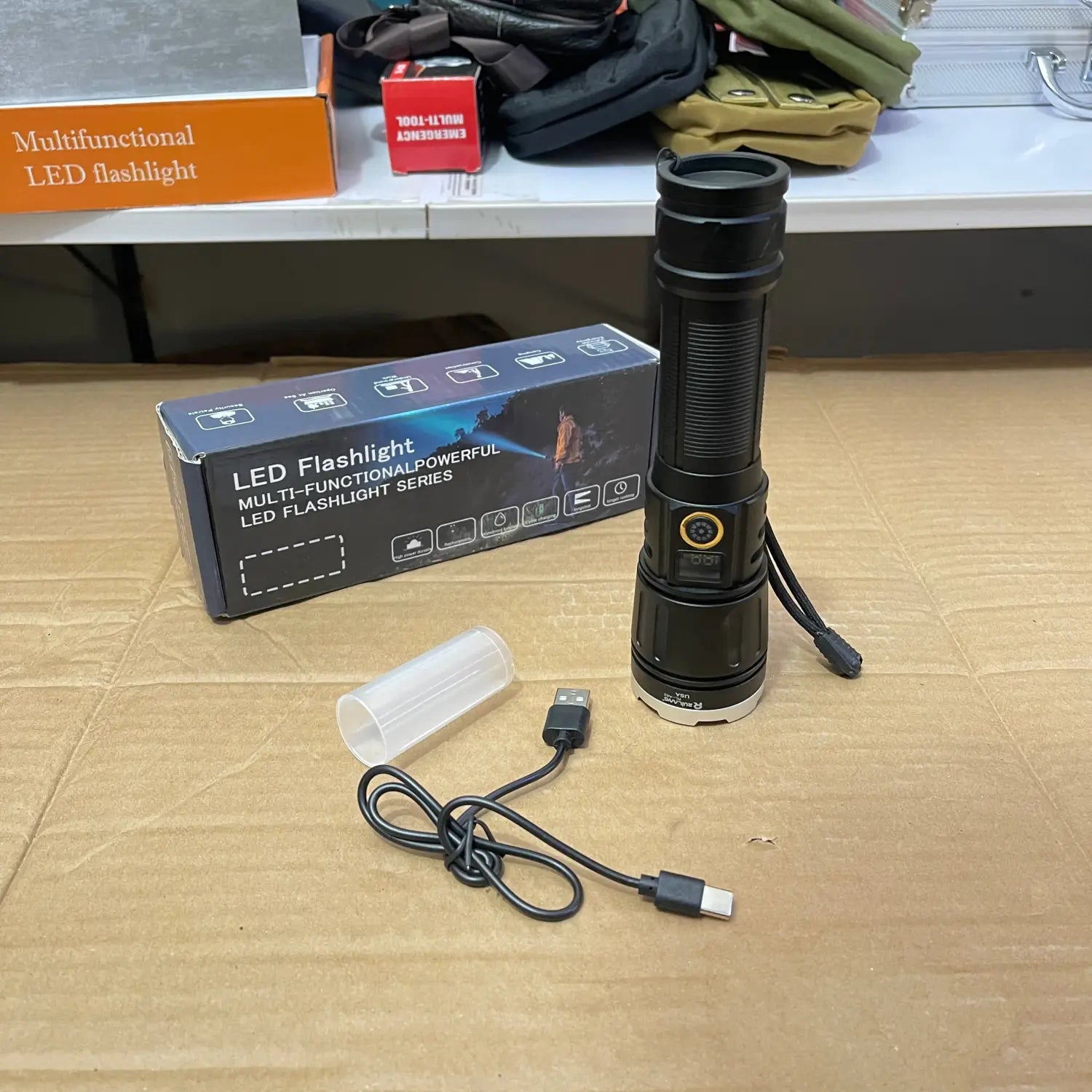 Black LED flashlight from Lot Imported Powerful Series with charging cable and protective sleeve