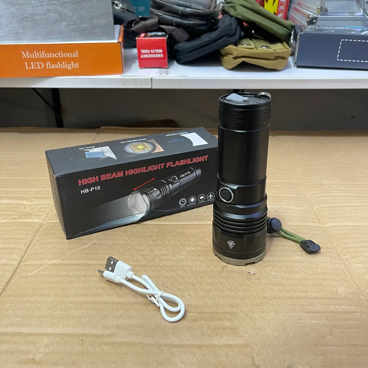 Black LED imported high beam flashlight with charging cable and packaging for beam flashlight enthusiasts
