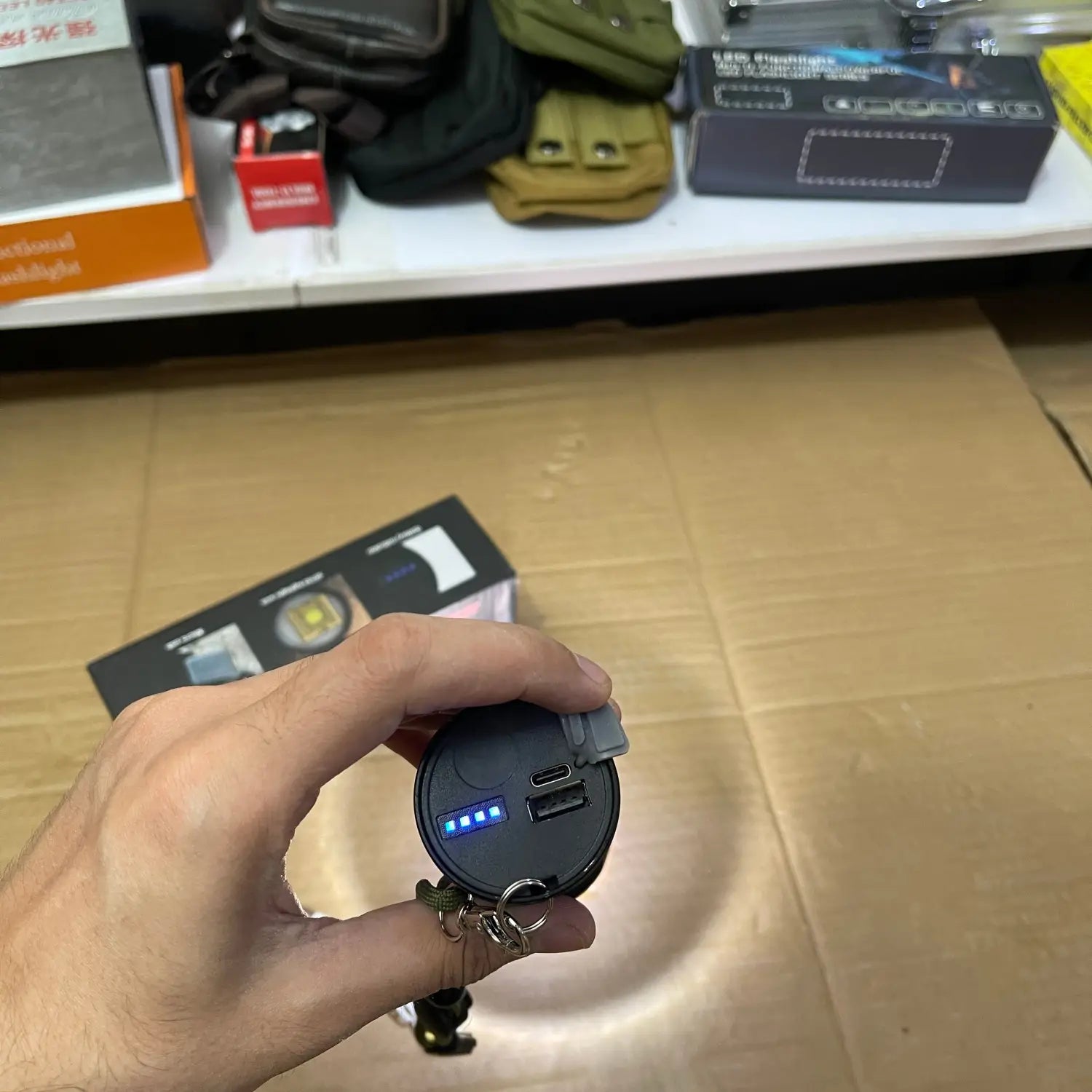 Handheld circular power bank with USB ports and battery indicator for Lot Imported High Beam Flashlight