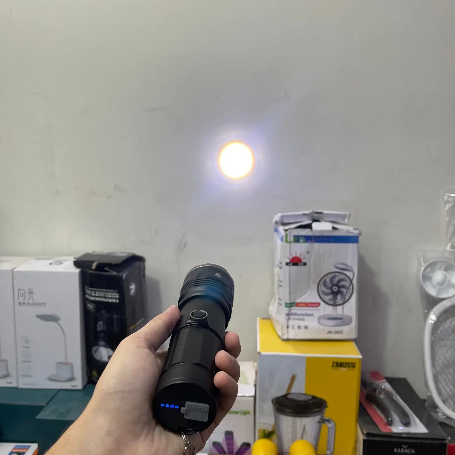 Imported high beam flashlight with rechargeable black body and blue power indicator