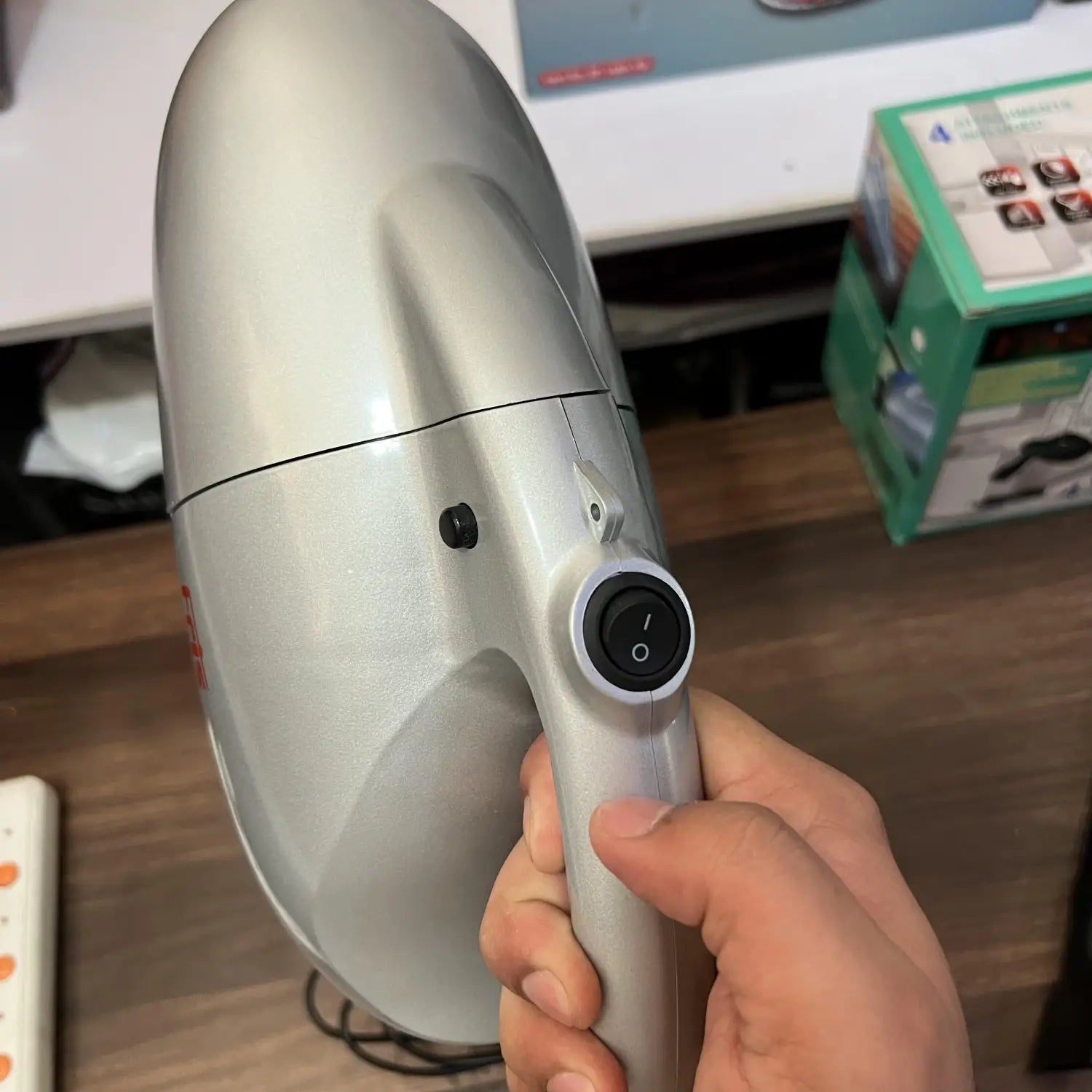 Silver handheld vacuum cleaner with power switch from Lot Imported Fris Vacuum Cleaner series