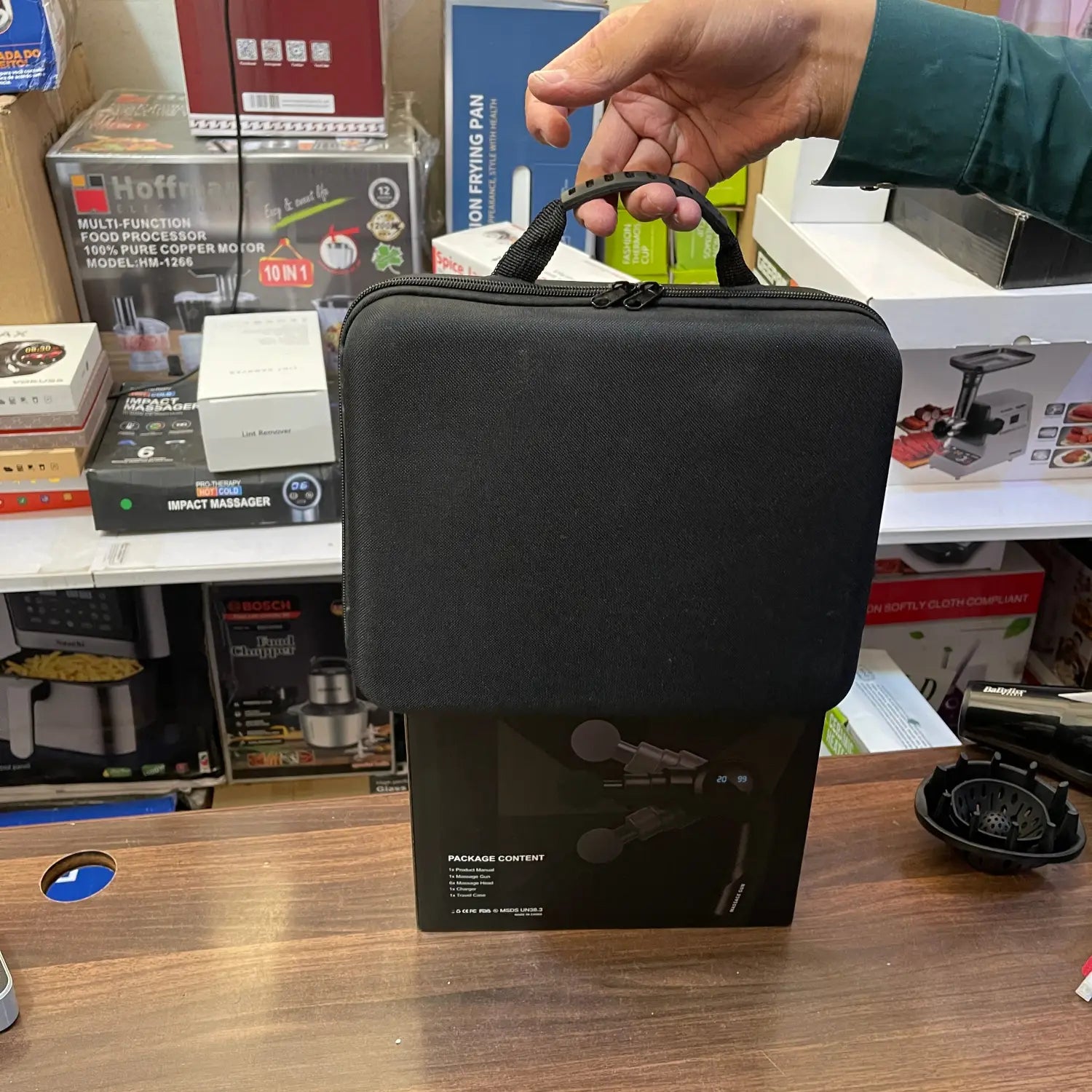 Black zippered carrying case with top handle holding a massager gun LE8 for folding massager use