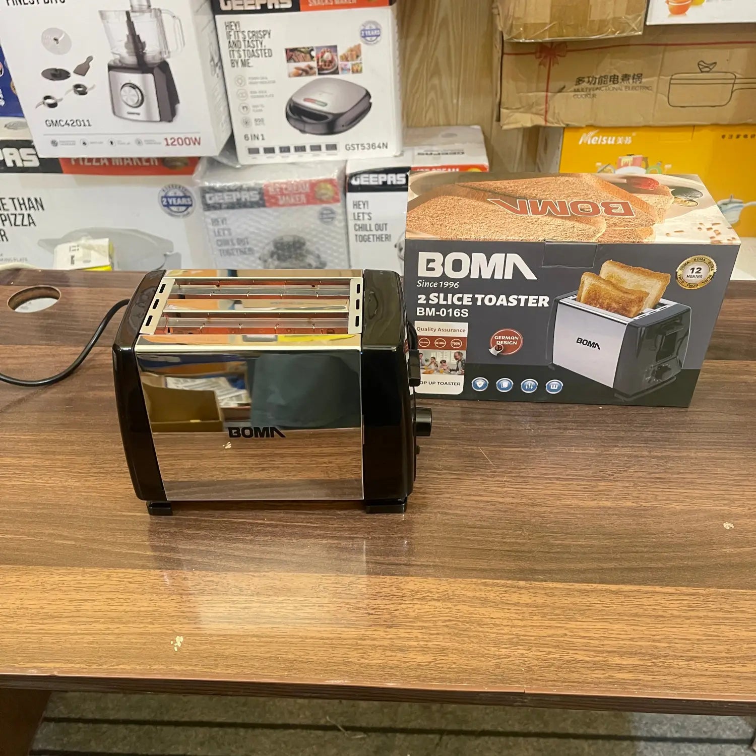Imported Boma Mini bread toaster in black and silver, ideal for mini bread.