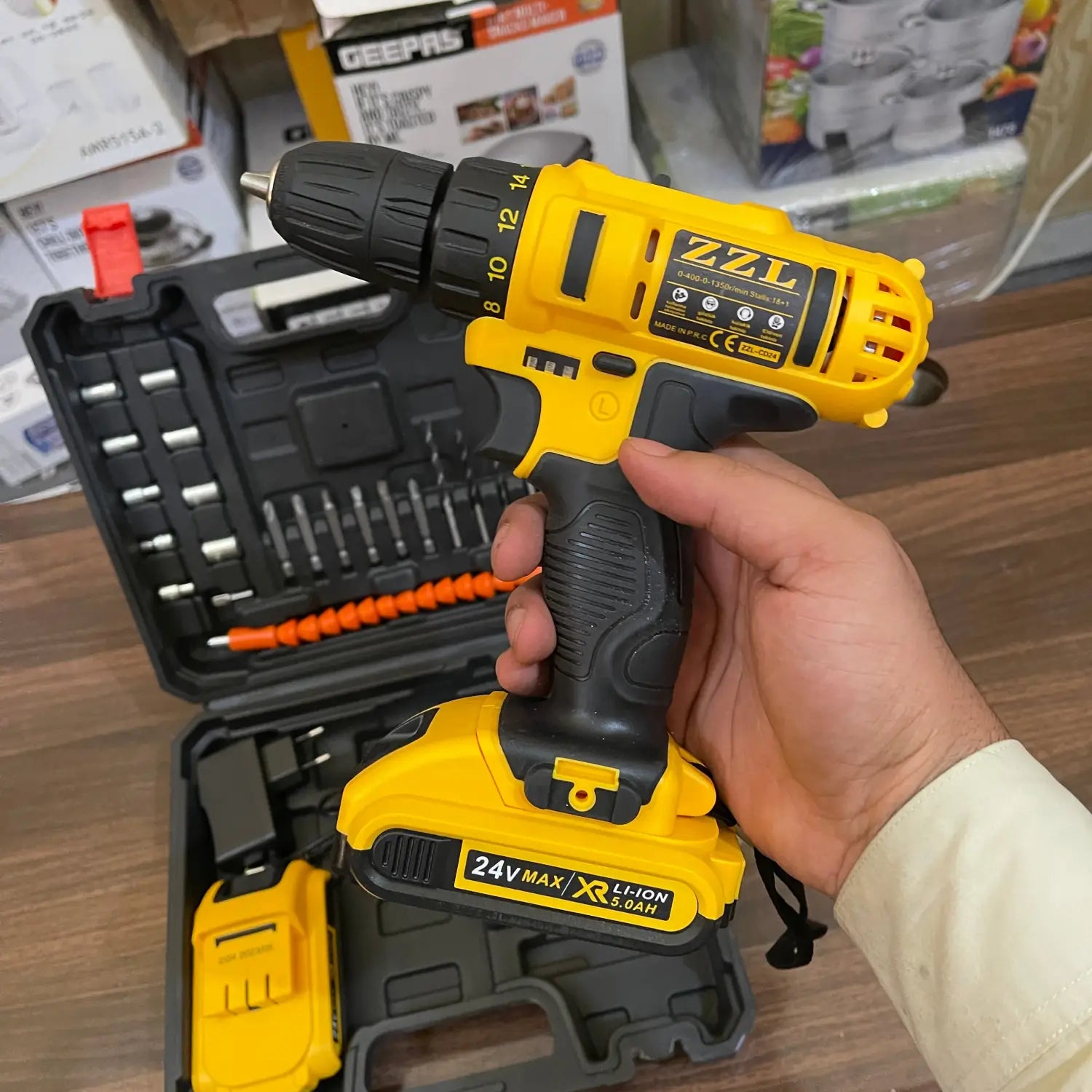 Alt text for 24V drill machine with tools and accessories in an open case.