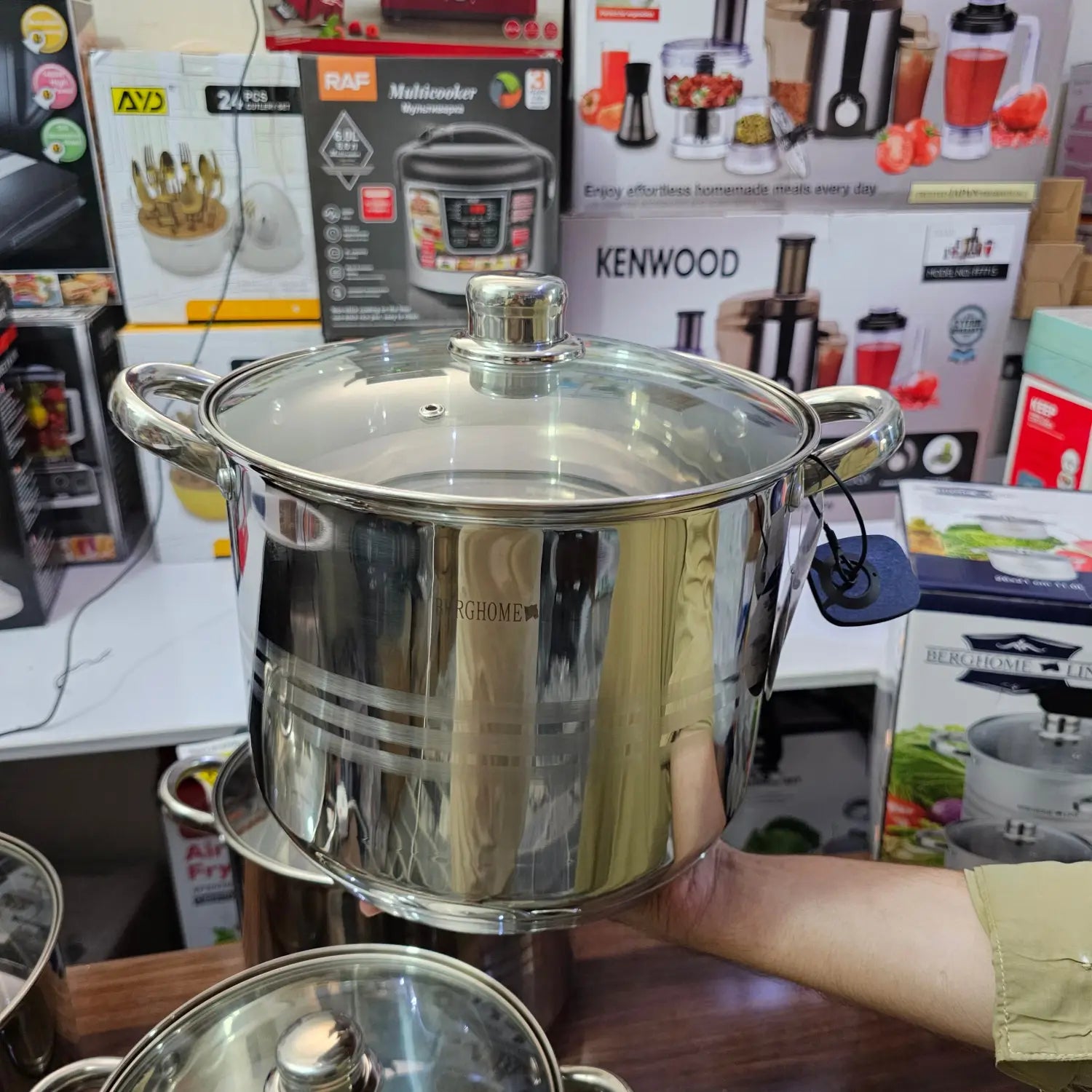 Shiny stainless steel cooking pot with glass lid from Lot Imported BergHome-Line 8 Piece Cookware set
