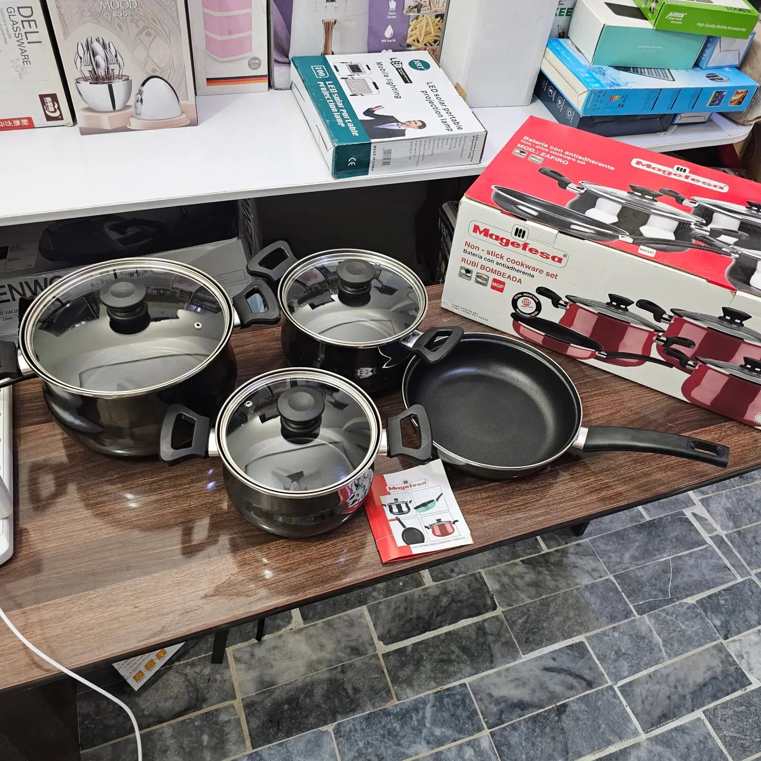 German Lot Imported Megafesa 4 Piece Cookware Set with dark-colored pots and casserole size pans