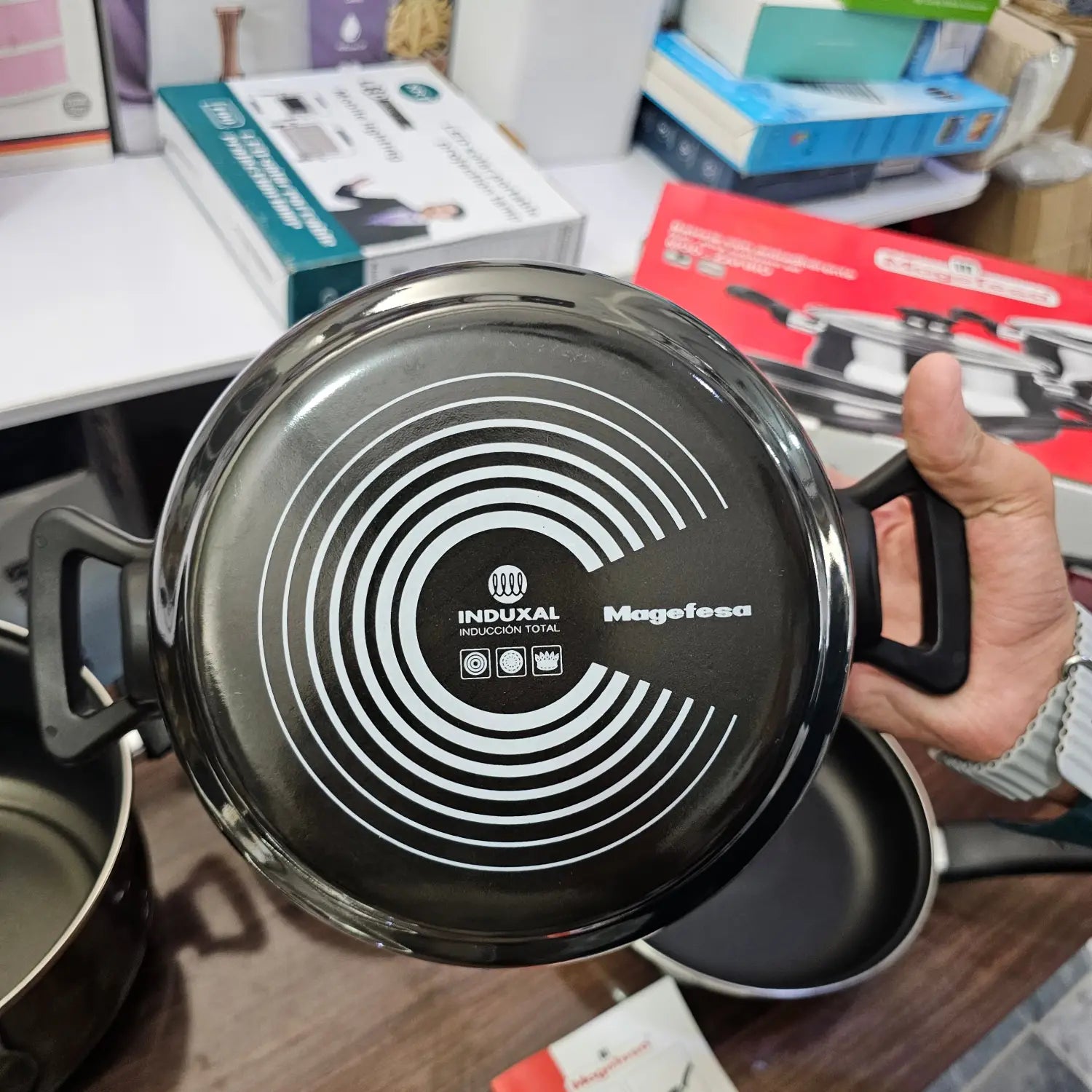 Black saucepan with induction-compatible base from German Lot Imported Megafesa cookware set