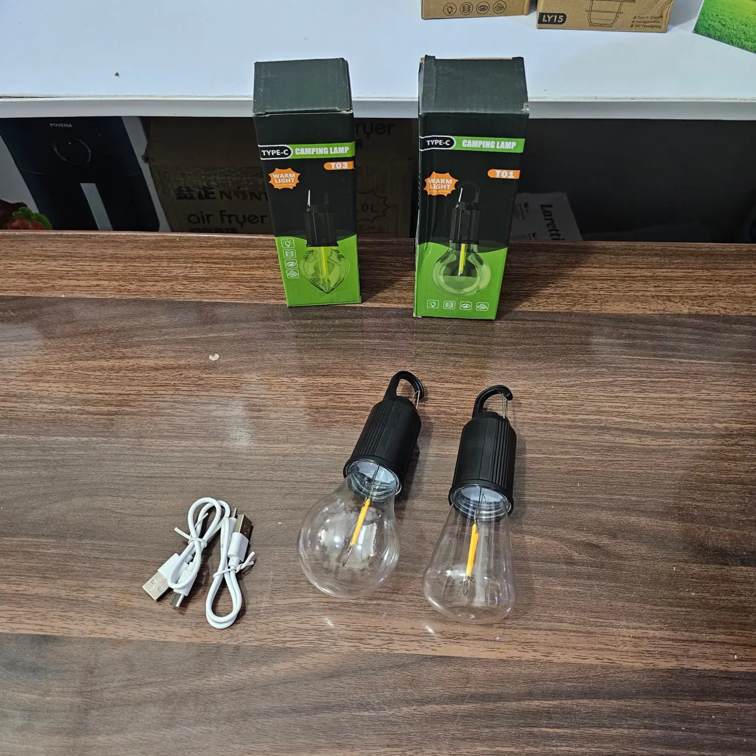 Two rechargeable portable LED camping light bulbs with USB-C cables in Lot Imported Camping Hand Torch