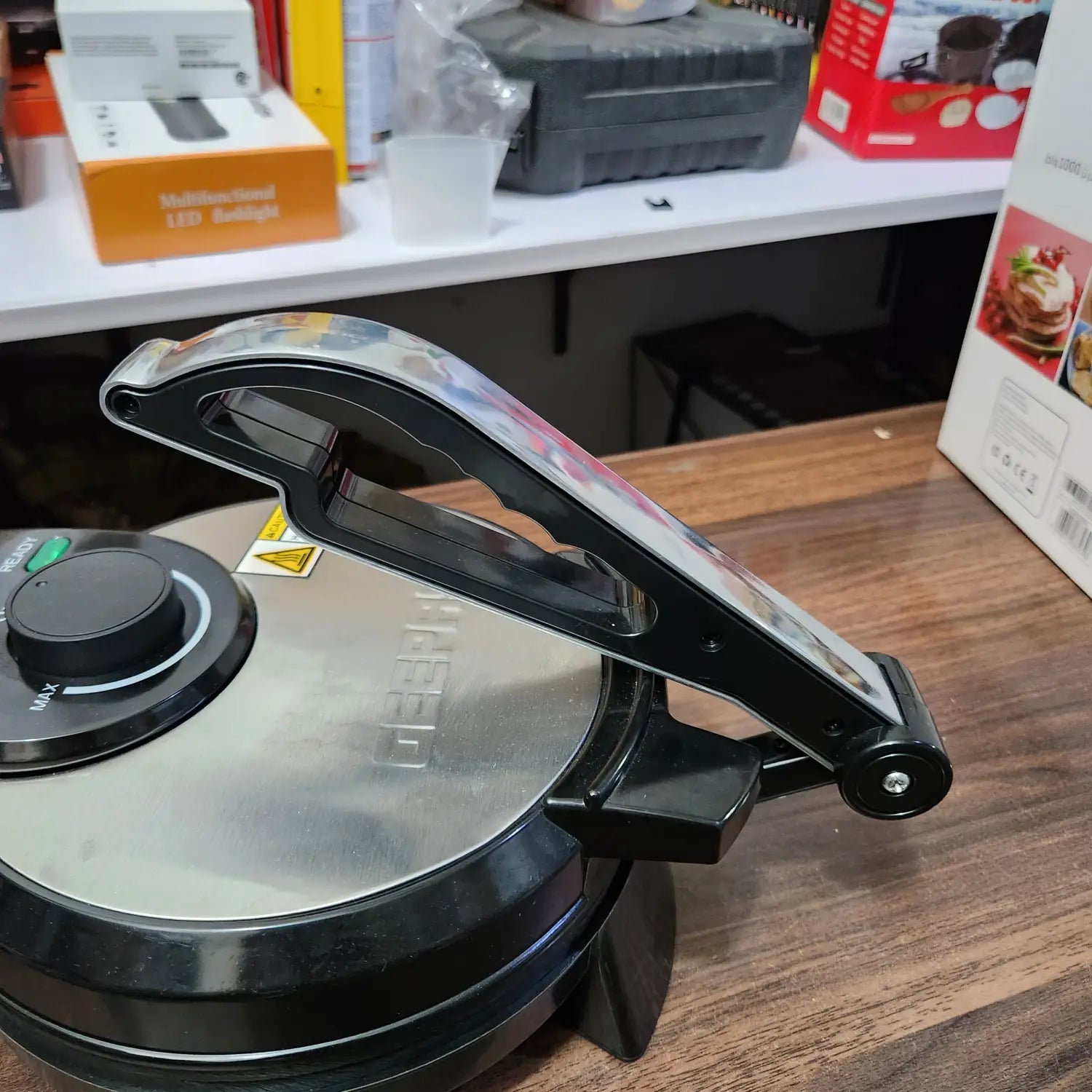 Original Geepas 8 Inch Chapathi Maker with warranty, featuring black and silver electric griddle