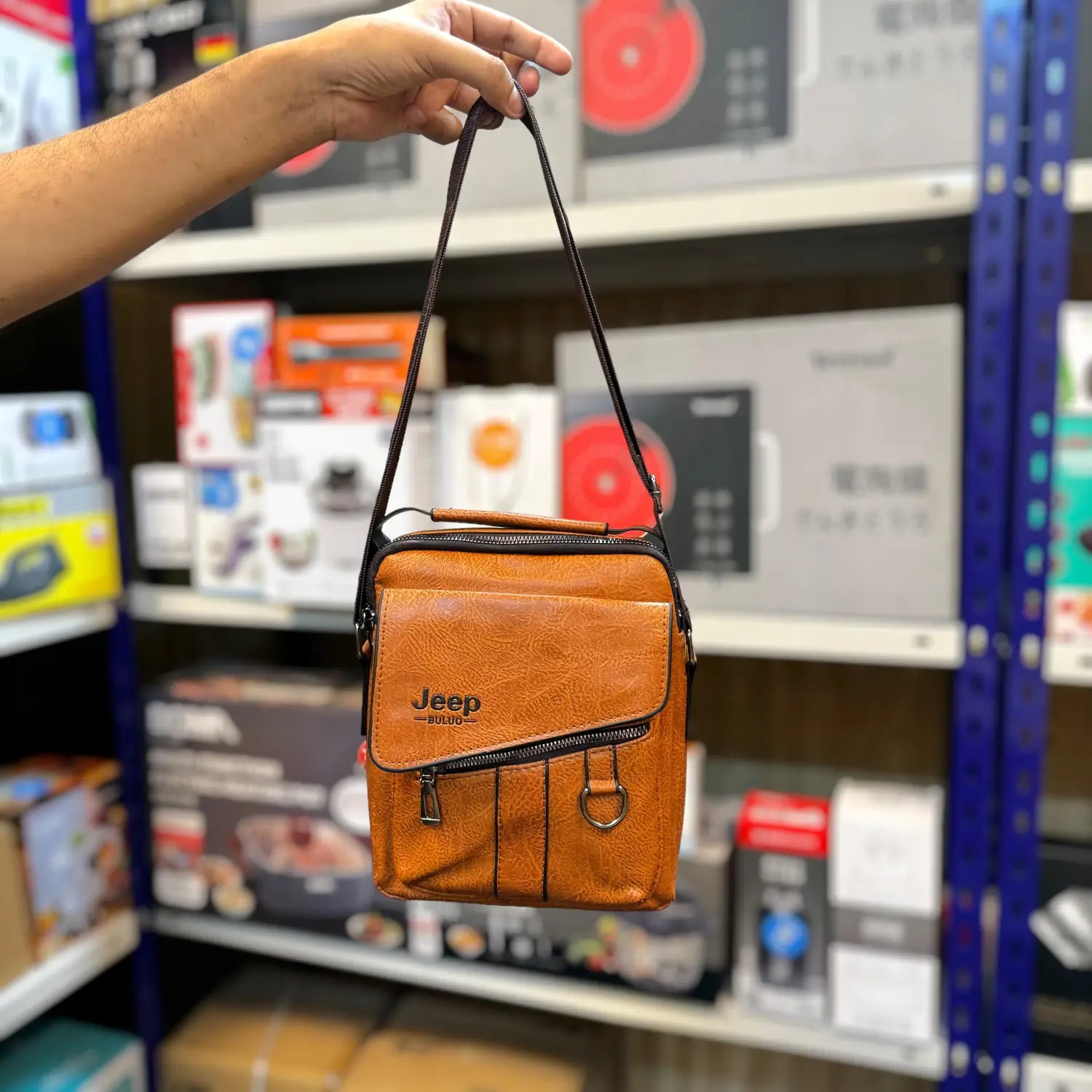 Imported leather messenger bag with shoulder strap, front flap, and zipper closure