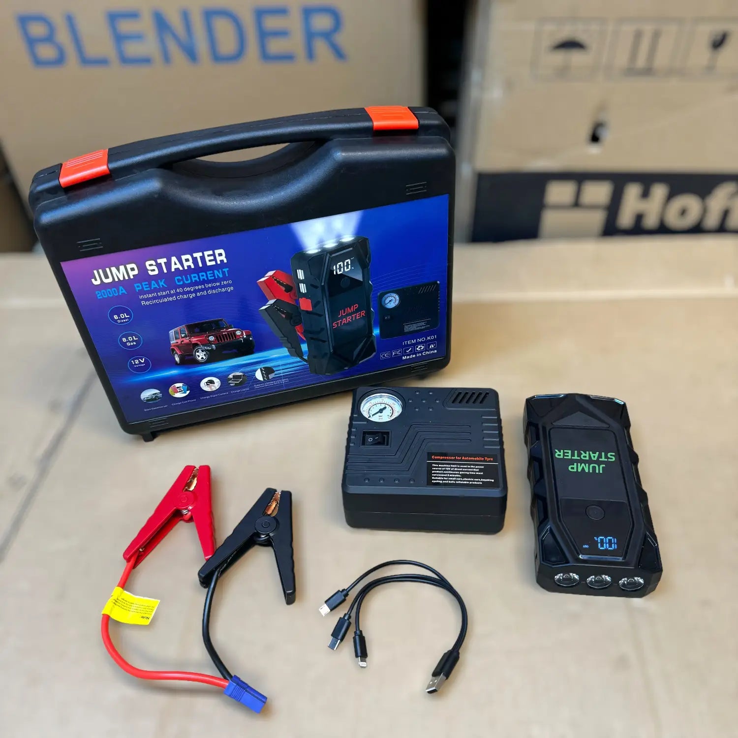 Portable car jump starter kit with tire inflator for emergency vehicle assistance